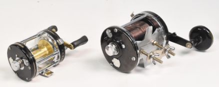 2x ABU Ambassadeur multiplier reels - features a 10000CA in black finish, stamped 761100 with rod