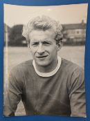 1962 Denis Law b&w press photograph 15cm x 20cm head & shoulders and in United team kit, photo taken
