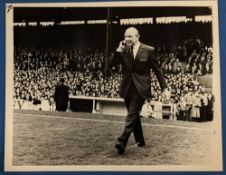 1967 b&w photograph 20cm x 16cm of Matt Busby entering the Old Trafford football pitch, prior to the