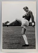 1962 Denis Law b&w photo 14½ cm v 20cm in Manchester Utd team kit for the 1st time at the training
