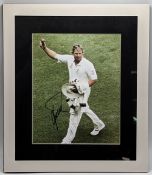 Australian Cricket Shane Warne signed colour photograph, mounted and framed under glass - size