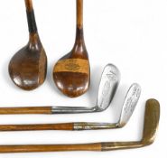 5x Assorted Golf clubs - 2x socket neck woods a large head stripe top driver stamped Renouf with a