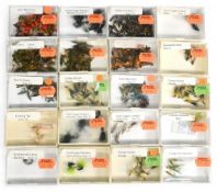 20 small trayed boxes containing a large collection of new old shop stock trout salmon flies, ex