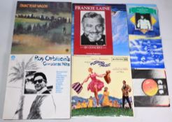 Selection of LP Records to include The Eagles Hotel California, Rod Stewart Foot Loose & Fancy Free,