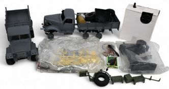 Remote Control Military Lorries Kits Lot comprises of 2 Part Built examples both with controllers
