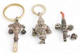 Silver Baby Rattles / Soothers 3 examples Birmingham 1920, Chester 1905, together with an unmarked