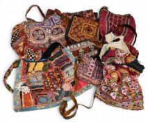 Collection of assorted Indian Tribal Fabric Bags, multi coloured, decorated with shells, mirrors and
