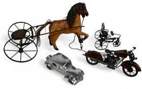 Four models of a wooden horse and trap (repair to one leg), a metal trike, a metal Citroen style car
