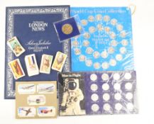 Cigarette Cards: 2 albums with various sets together with Shell Man in Flight coin, ESSO 1970