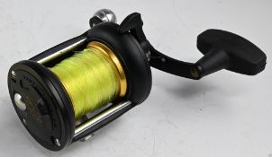 Penn 525 Mag free spool star drag, sliding tensioner, on/off check, 'T' handle with counter