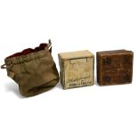 Collection of reel boxes and pouch, as follows: Hardy Bros box for Skeleton Tournament fly reel 4" x