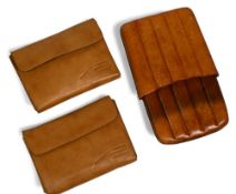 Giorgio Benecchi fly wallets, leather with wool lining, both with quantity of trout flies. Plus a
