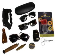 Collection of fishing accessories, as follows: 3x pairs of sunglasses. A multi tool. Waistcoat oiler