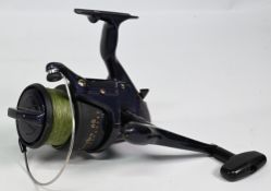Okuma Beachcaster 65 fixed spool reel, good bail spool tensioner, on/off check, light wear, runs