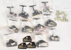 Collection of unused Abu Cardinal reel parts such as frames side plates & drag knobs, models include