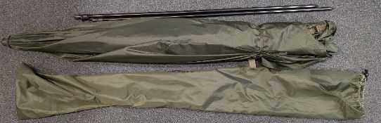 Large green nylon Infinity Fishing Umbrella, with two poles and pegs