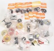 Quantity of unused Abu Garcia Ambassadeur reel parts such as frames, side plates, many appear in