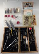 Mixed collection of fly-tying tools, including vice, scissors, bobbin holders etc, in wooden box,