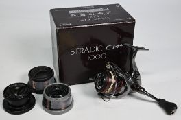 Shimano Stradic C14+ 1000B fixed spool reel, good bail, spool tensioner. In original box with