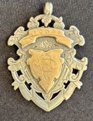 1900 Rugby Medal: Hallmarked silver shield shaped decorative medal with loop for chain, gilt