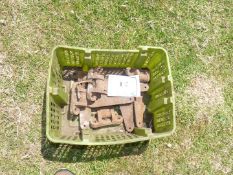 A box of cast iron hinges.