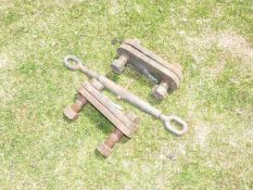 A turn buckle tensioner and a pair of cast iron fish plates/joiners.