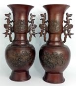 A pair of 20th century Japanese bronze vases, in Meiji period style, applied foliate decoration,