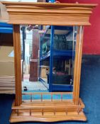 A modern wooden bathroom mirror unit with light fitting and reeded shelf, height 87cm, width 65cm.