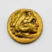 A small gold coin, approx 3.8g.