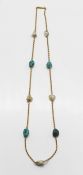 A gold turquoise and pearl set necklace (not hallmarked), overall length approx 47cm.