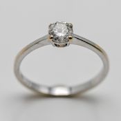 An 18ct white gold solitaire ring, set with one round brilliant cut diamond approx 0.52ct assessed