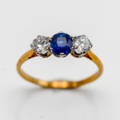 A 9ct gold sapphire and diamond three stone ring, size N.