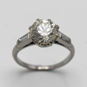 A platinum old brilliant cut single diamond ring approx 2.5ct set with two baguette cut diamonds