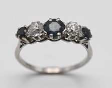 An 18ct white gold five stone sapphire and diamond ring, size P/Q, approx 3.5g.