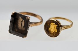 A 9ct smokey quartz ring, and a citrine ring,, set in yellow gold unmarked, approx 11.3g.