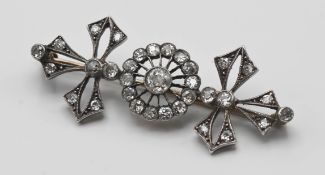A Victorian diamond set brooch set with an open arrangement of old cut diamonds.