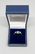 An 18ct yellow gold emerald and diamond set ring, size O, approx 2.7g.