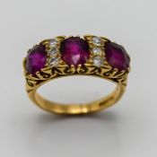 An 18ct antique ruby and diamond ring, set with three ruby's and six diamonds, size L
