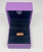 Gemporia, a 9k gold Kurundu Garnet and Diamond ring, size S, with certificate of authenticity,