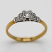 An 18ct yellow gold diamond set ring, size N.