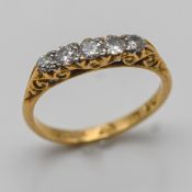 An 18ct five stone ‘old cut’ diamond ring, size N, approx 3g.