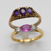 A 9ct amethyst three stone ring, approx 3.2g and an 18ct pink sapphire three stone, approx 2.9g (2)