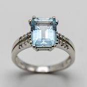 An 18ct white gold aquamarine and diamond set dress ring, with claw setting, size O.