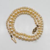 A single string of pearls set on a 9ct gold clasp, length approx 45cm
