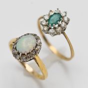 A 9ct emerald and diamond cluster ring approx 1.4g and an 18ct opal and diamond ring, approx 3.2g (