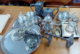 A large quantity of silver plated ware, to include asparagus tongs, picture frame, candlesticks,