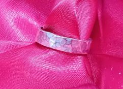 A platinum handmade wedding band, approx 6.2g, size M.