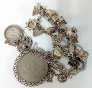 Mixed collection of silver jewellery including pendants, coins 95.5 grams.