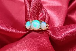 An 18ct yellow gold ring set with opal and diamond's, approx 3.1g, size K/L.