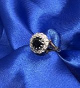 A 9ct gold sapphire and diamond cluster ring, approx 3.8g, size O.